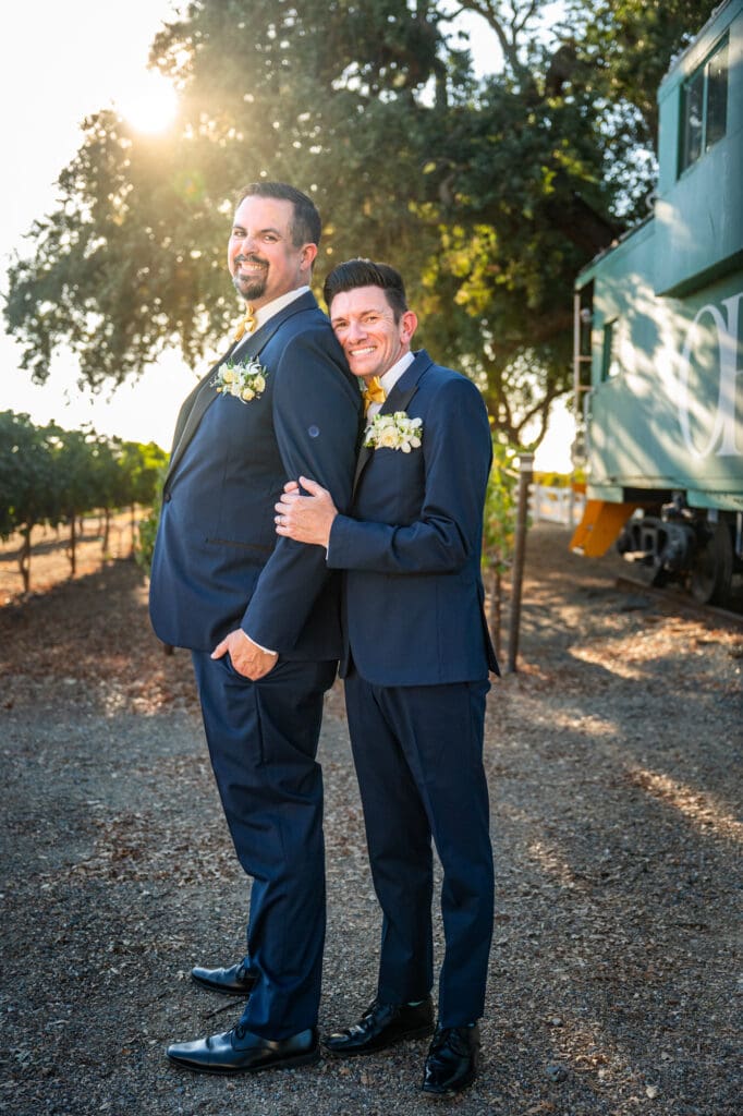 grooms smiling on wedding day