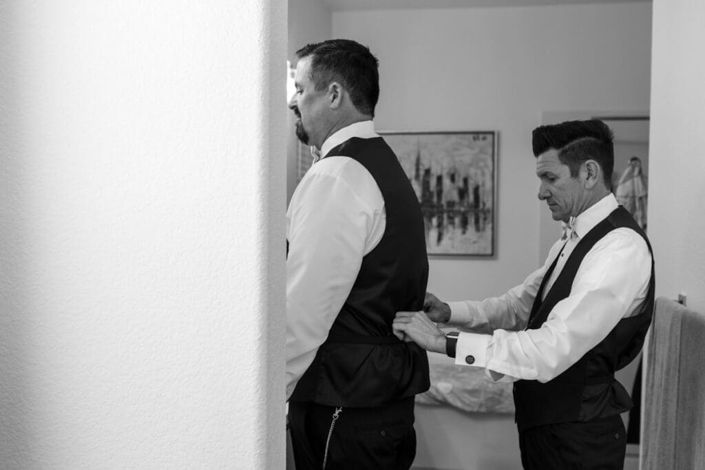 grooms getting ready in bathroom