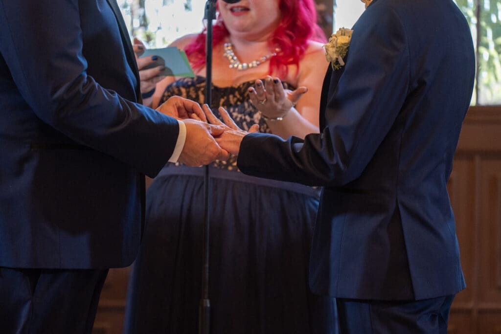 grooms exchanging rings
