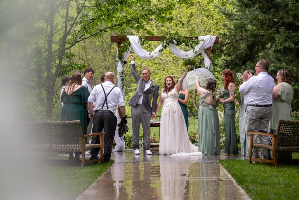 bride and groom celebrating at the alter
